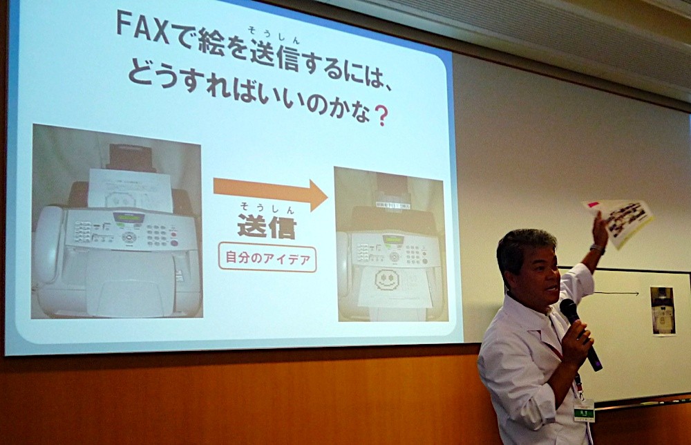 Mr. Idosaka explains the concept at Fujitsu Kids event with JOI, Japan
